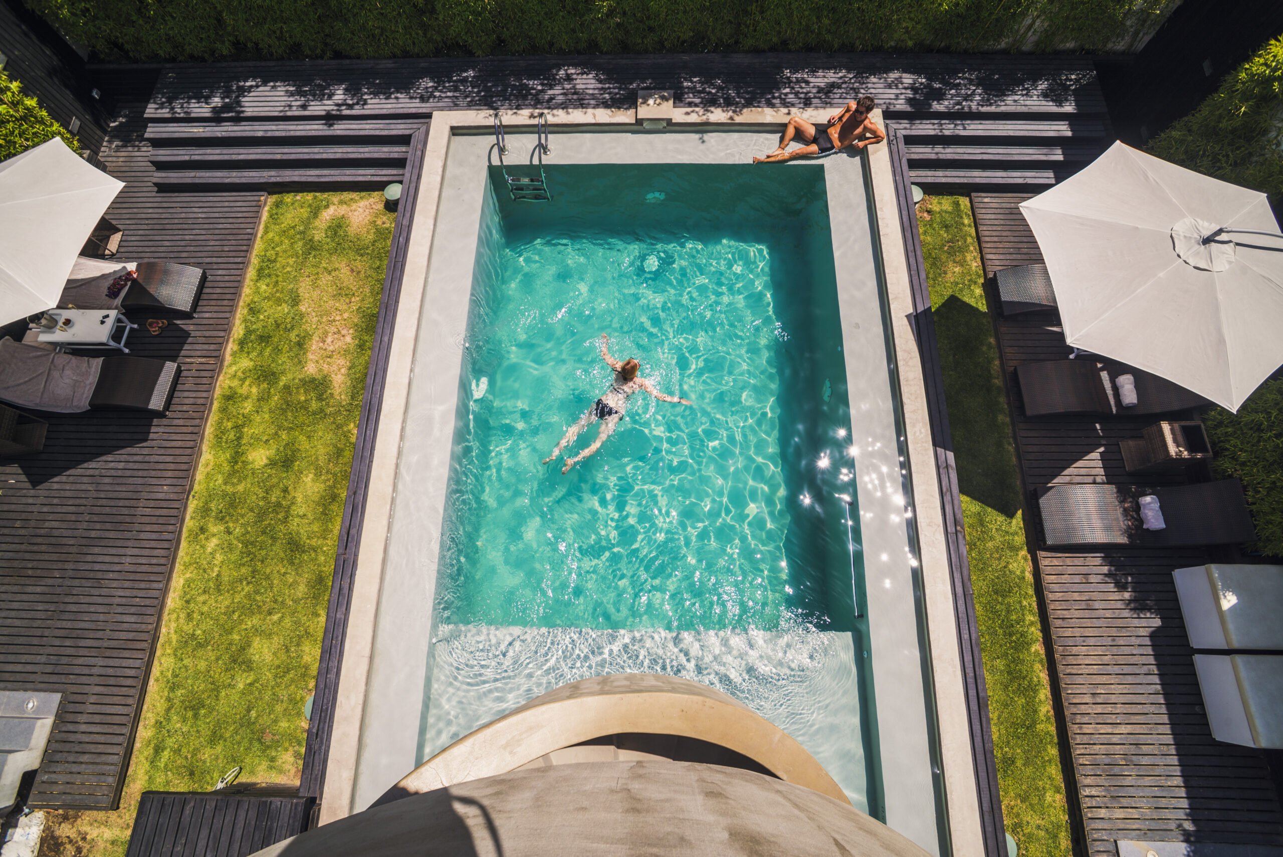 Couple at a swimming pool on vacation at luxury hotel accommodation, Santiago, Chile, South America