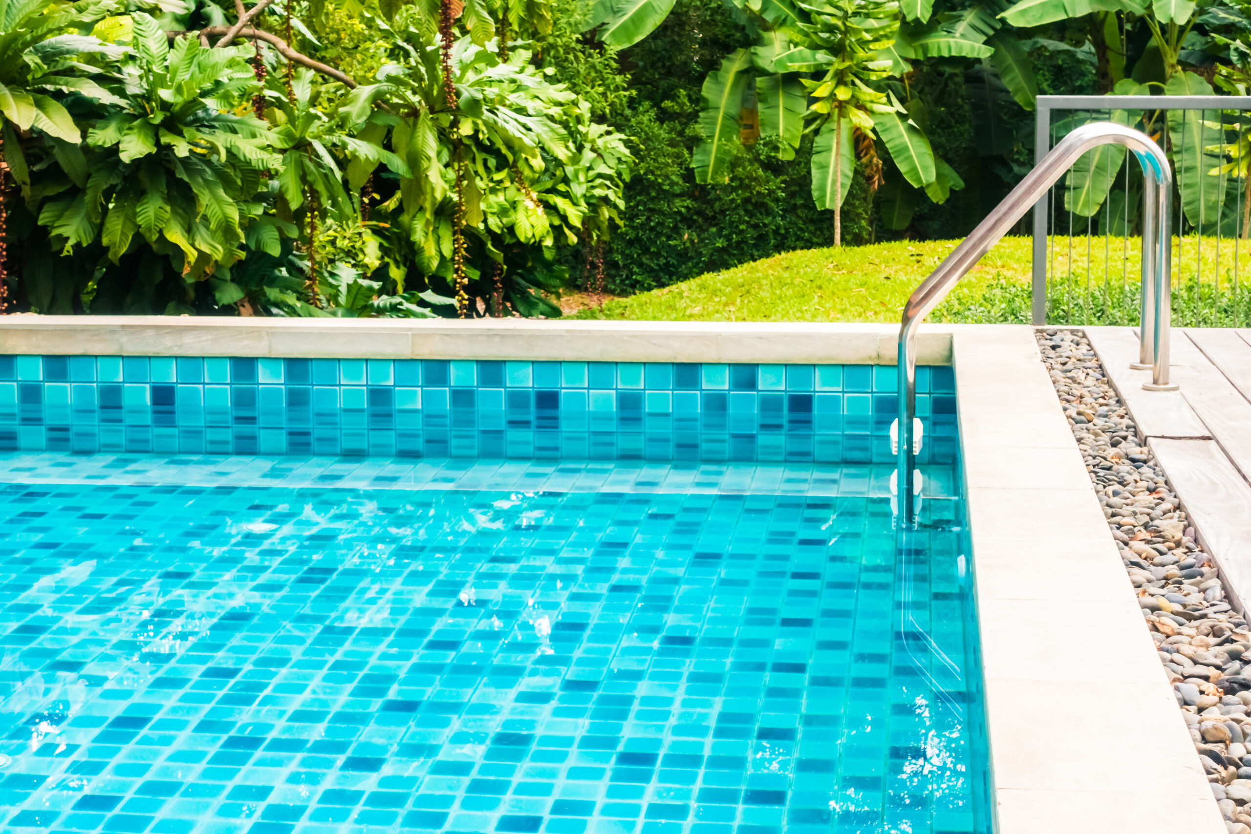 Outdoor swimming pool around hotel and resort - Holiday Vacation concept