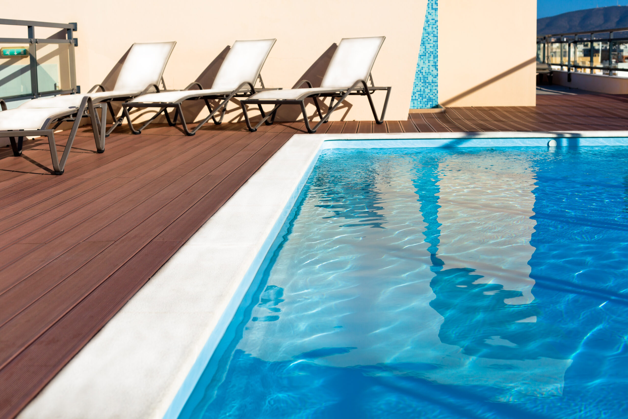 Outdoor swimming pool at a house roof. Horizontal shot