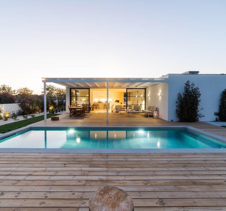Modern house with garden swimming pool and wooden deck