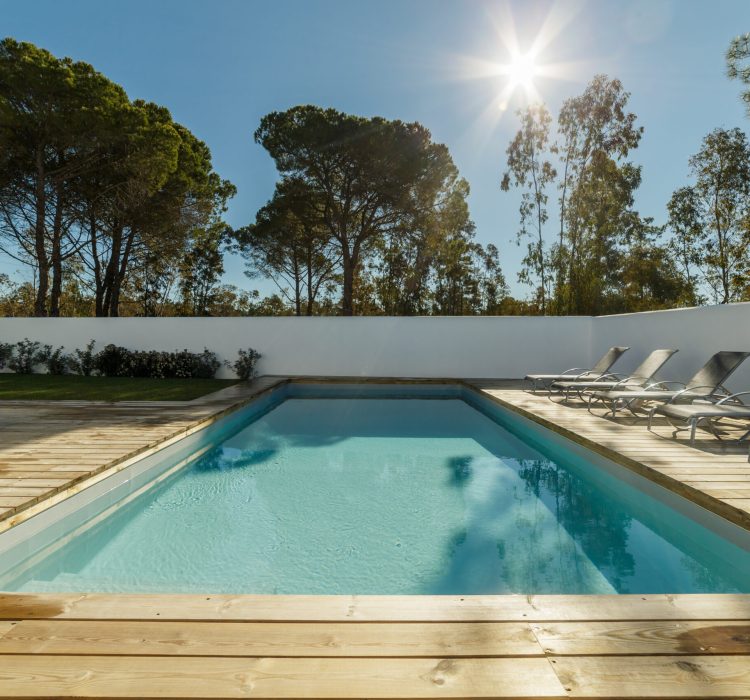 Modern house with garden swimming pool and wooden deck